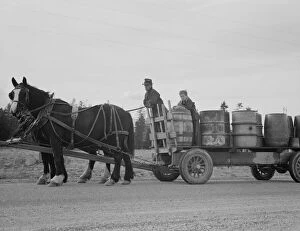 Drinking Water Gallery: Possibly: Farmer and his boy hauling water for drinking and domest... Boundary County, Idaho, 1939