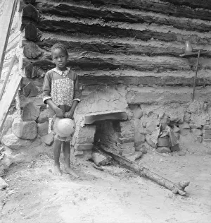 Sharecropping Prints: Possibly: Grandchildren of tobacco sharecropper down at barns