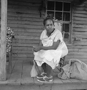 Porch Gallery: Possibly: Mother of sharecropper family and friend...the rain, Person County, North Carolina, 1939