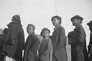 Possibly: Negroes in the lineup for food at meal time in the camp... Forrest City, Arkansas, 1937