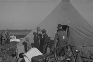 Flooding Gallery: Possibly: Setting up a tent in the camp for white flood refugees, Forrest City, Arkansas, 1937