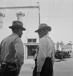 Humulus Lupulus Gallery: Possibly: Williamette Valley hop farmers in town hold their... Independence, Oregon, 1939