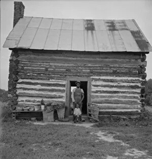 Sharecropper Gallery: Possibly: Young sharecropper and his first child, Hillside Farm, Person County, North Carolina