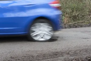 Pot holes in road surface 2017. Creator: Unknown