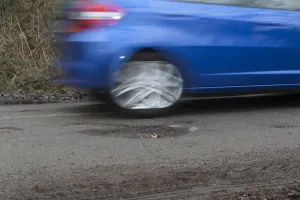 Pot holes in road surface 2017. Creator: Unknown