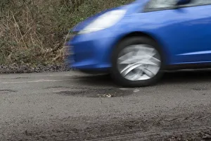 Pot holes in road surface 2017. Creator: Unknown