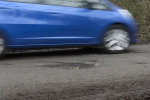 Pot holes in road surface 2017. Creator: Unknown