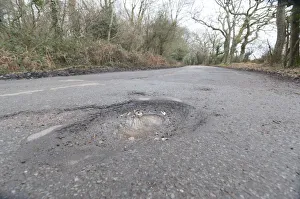 Pot holes in road surface 2017. Creator: Unknown