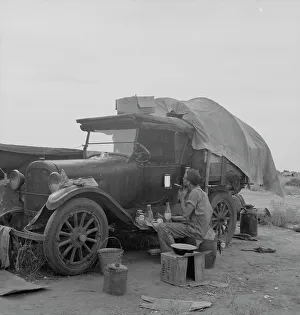 Camping Out Prints: Potato picker in camp near Shafter, California, 1937. Creator: Dorothea Lange