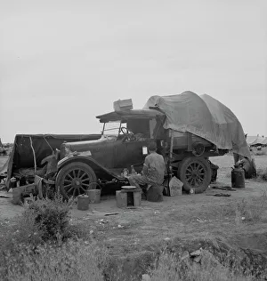 Camping Out Prints: Potato picker in camp near Shafter, California, 1937. Creator: Dorothea Lange