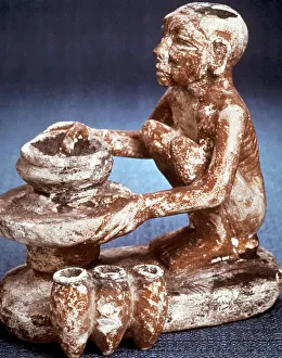 Machine Prints: Potter turning vessels on a wheel