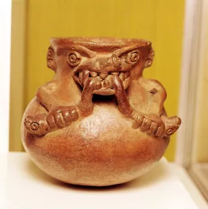 Pottery Bowl of an alligator with human arms devouring snakes, Chiriqui, Panama Pottery Bowl of an alligator with human arms devouring snakes, Chiriqui, Panama