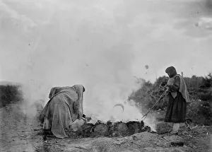 Tewa Prints: Pottery burners at Santa Clara, c1905. Creator: Edward Sheriff Curtis