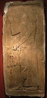 Priest with a branch of pomergranate tree. Detail of a relief from the palace of Assyrian king Sargon II, 722-705 BC Priest with a branch of pomergranate tree. Detail of a relief from the palace of Assyrian king Sargon II, 722-705 BC