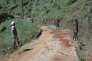 Primitive road-repairs in Sri Lanka. Artist: CM Dixon