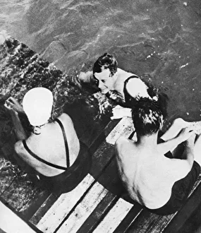 Swimming Cap Prints: The Prince of Wales with friends on a raft, the Riviera, c1930s