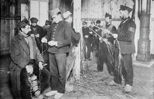 Zossen Brandenburg German Prints: Prisoners at Zossen making straw shoes, 24 Feb 1915. Creator: Bain News Service