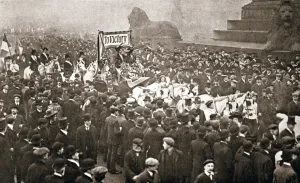 Emmeline Goulden Prints: Procession to welcome the early release of suffragettes from prison on 19 December 1908