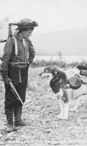 Prospecting Prints: Prospector and dog ready for the summer trail, between c1900 and c1930. Creator: Unknown