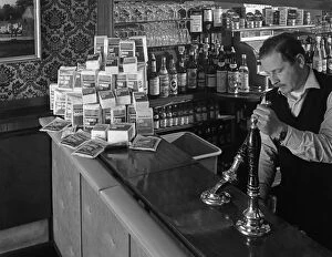 Batchelors Gallery: A pub landlord with a display of the Batchelors 5 day catering pack on his bar, 1968