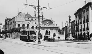 Trolley Gallery: Public tram moving through the streets of Mataro, in front of the Escuelas Pias