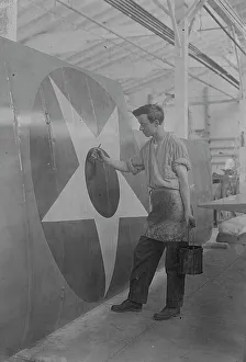 Star Pattern Prints: Putting U.S. Emblem on plane, between c1915 and c1920. Creator: Bain News Service
