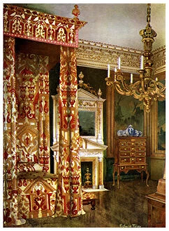 Edwin Foley Gallery: Queen Annes bed, chest of drawers upon a stand and a wooden candelabra, 1910.Artist: Edwin Foley