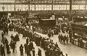Train Station Prints: A Queue of Holiday-Makers Waiting for Trains at Waterloo Station, London, 1930