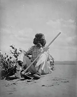 Hoeing Prints: A quiet smoke-Hopi, c1907. Creator: Edward Sheriff Curtis