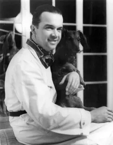 Racing driver Rudolph Caracciola with his pet dog. Creator: Unknown Racing driver Rudolph Caracciola with his pet dog. Creator: Unknown