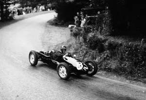 Cornering Prints: A racing driver speeding round a bend
