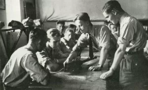 Airman Collection: RAF personnel learning about weapons, 1941. Creator: Charles Brown