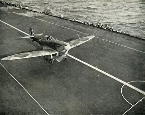 Delivering Gallery: RAF Spitfire on the deck of an aircraft carrier on its way to Malta, World War II, 1942 (1944)