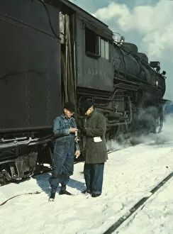 Railroad conductor George E. Burton and engineer J.W. Edwards...Chicago, Ill. 1943. Creator: Jack Delano