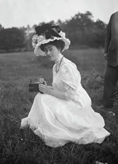 Portrait Photographs Prints: Rainsford, Mrs. seated outdoors, between 1922 and 1924. Creator: Arnold Genthe