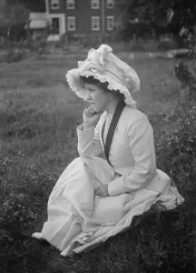 Portrait Photographs Prints: Rainsford, Mrs. seated outdoors, between 1922 and 1924. Creator: Arnold Genthe