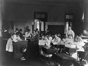Rainy day activities in school - decorating the classroom, (1899?). Creator: Frances Benjamin Johnston