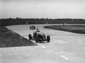 Rapier Prints: Rapier Special Racing single seater leading a MG in a race on the Campbell Circuit at Brooklands