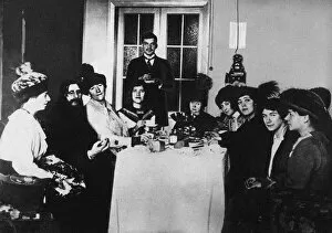 Emperor Nicholas Ii Of Russia Gallery: Rasputin (second from left) at the meal among His Admirers, c. 1910