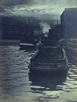 Tugboat Prints: Rear view of tugboats approaching a wharf