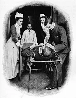 Stretcher Collection: Receiving an accident case at Poplar Hospital, London, c1903 (1903)
