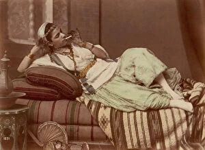 Albumen Silver Print From Glass Negative With Applied Color Gallery: Reclining Woman Smoking, 1870-90. Creator: Unknown