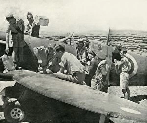 Airplane Collection: Refuelling and re-arming Spitfire fighters, Malta, World War II, 1942 (1944). Creator: Unknown