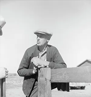 Rehabilitation client talking over fence with county supervisor, near Stockton, CA, 1938. Creator: Dorothea Lange
