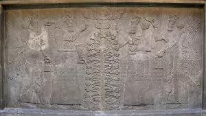 Relief with two figures of Ashurnasirpal, winged mythological beings and the god Ashur, before the Tree of Life