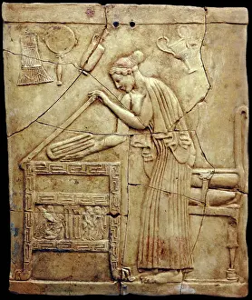 Terracotta Prints: Relief pinax from Locri depicting a woman placing laundry in a laundry chest