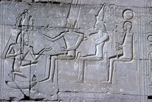 Relief of Rameses II kneeling before Amun Mut & Khons, The Ramesseum, Luxor, Egypt, c1250 BC Relief of Rameses II kneeling before Amun Mut & Khons, The Ramesseum, Luxor, Egypt, c1250 BC