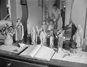 Candles Gallery: Religious objects and an improved altar in the bedroom... Washington, D.C. 1942