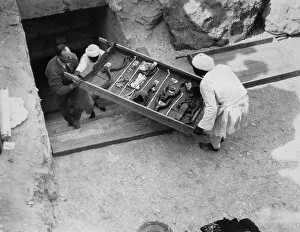 Archaeologist Gallery: Removing a tray of chariot parts from the Tomb of Tutankhamun, Valley of the Kings, Egypt, 1922