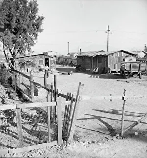 Cabins Prints: Rent eight dollars per month, near Bakersfield, California, 1939. Creator: Dorothea Lange